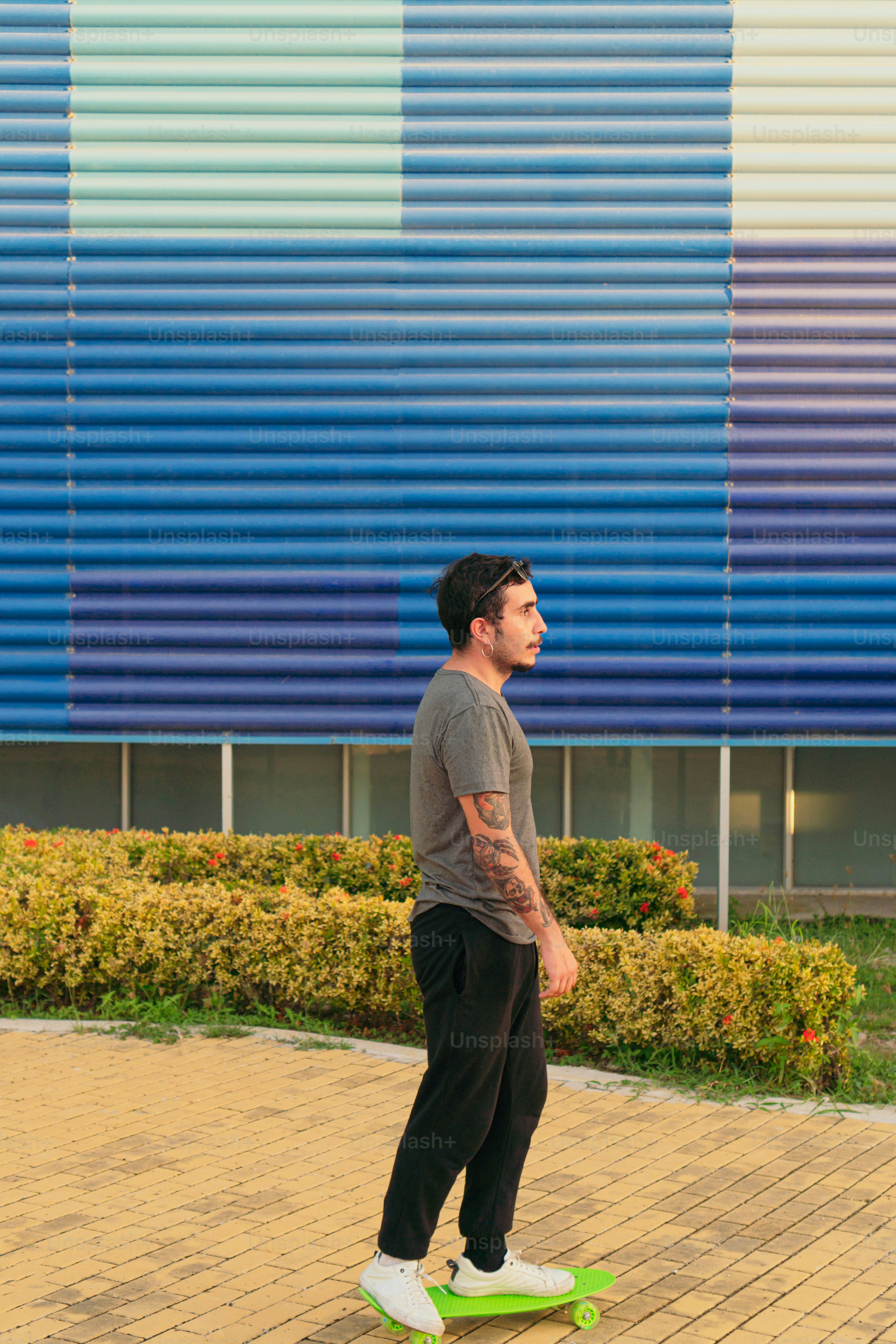 Hispanic man using his skateboard on a sunny day