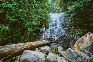 Women travel. woman asia travelers travel nature Forests, mountains, waterfalls. Travel Siliphum Waterfall at Chiangmai, in Thailand.