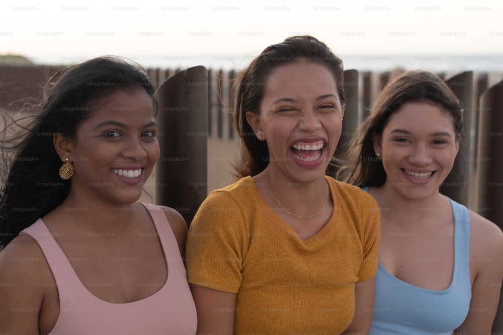 Happy beautiful women having fun in the city. Femininity Concept.