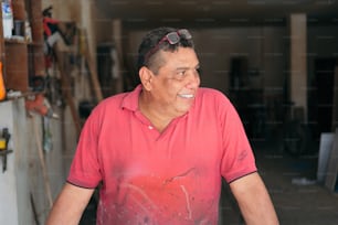 Portrait of Latin male carpenter in workshop.