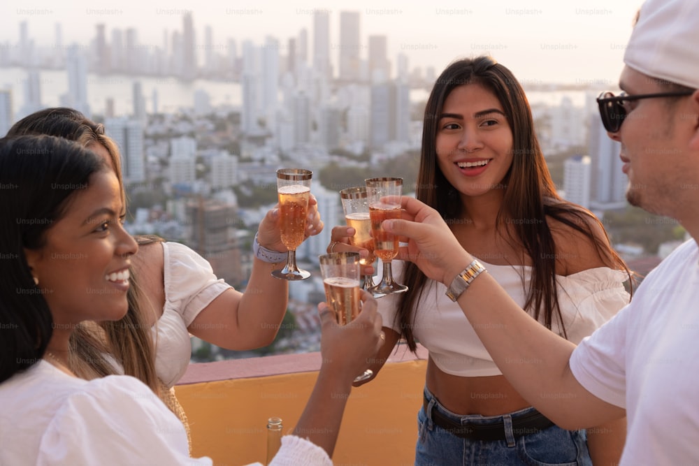 Latin friends toasting wine glasses in party