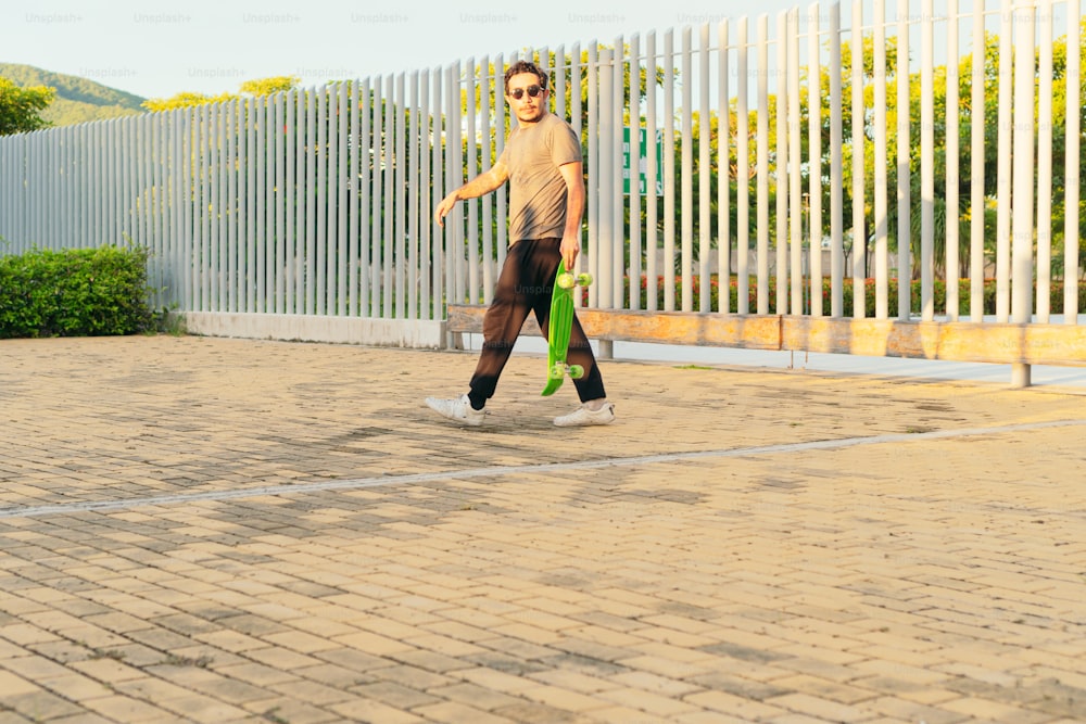man arriving at college on a skateboard