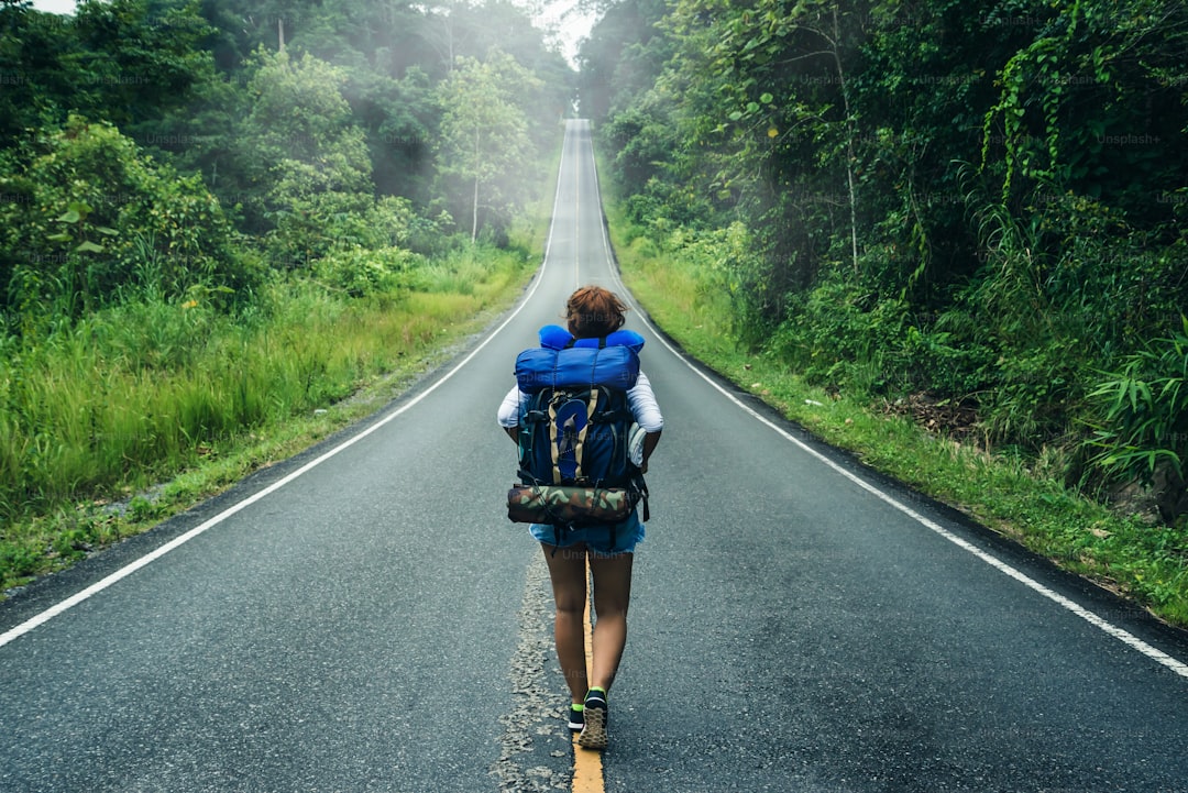 Asian women travel relax in the holiday. on the road"nNatural route. Thailand