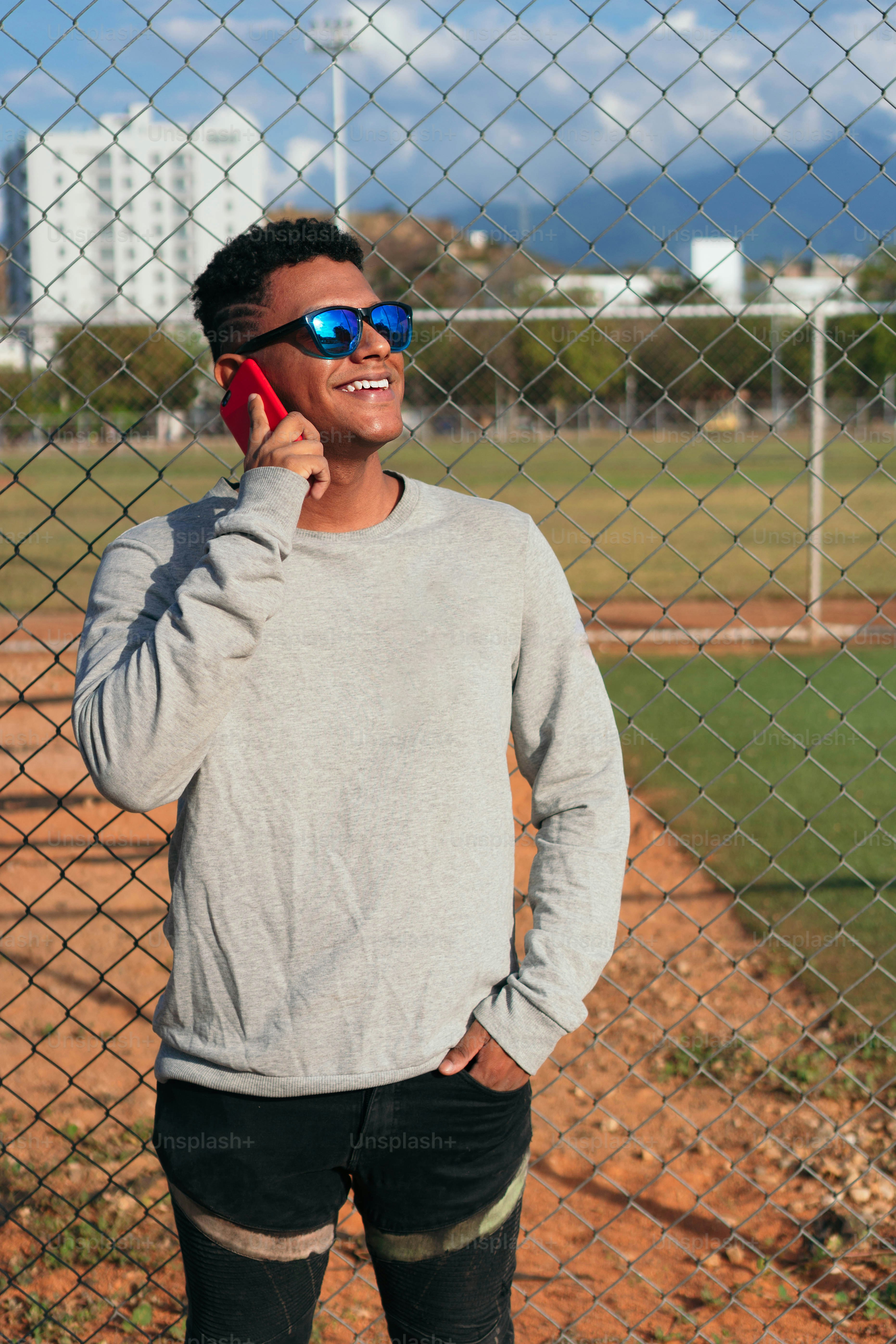 Portrait of a smiling young man talking on his cell phone