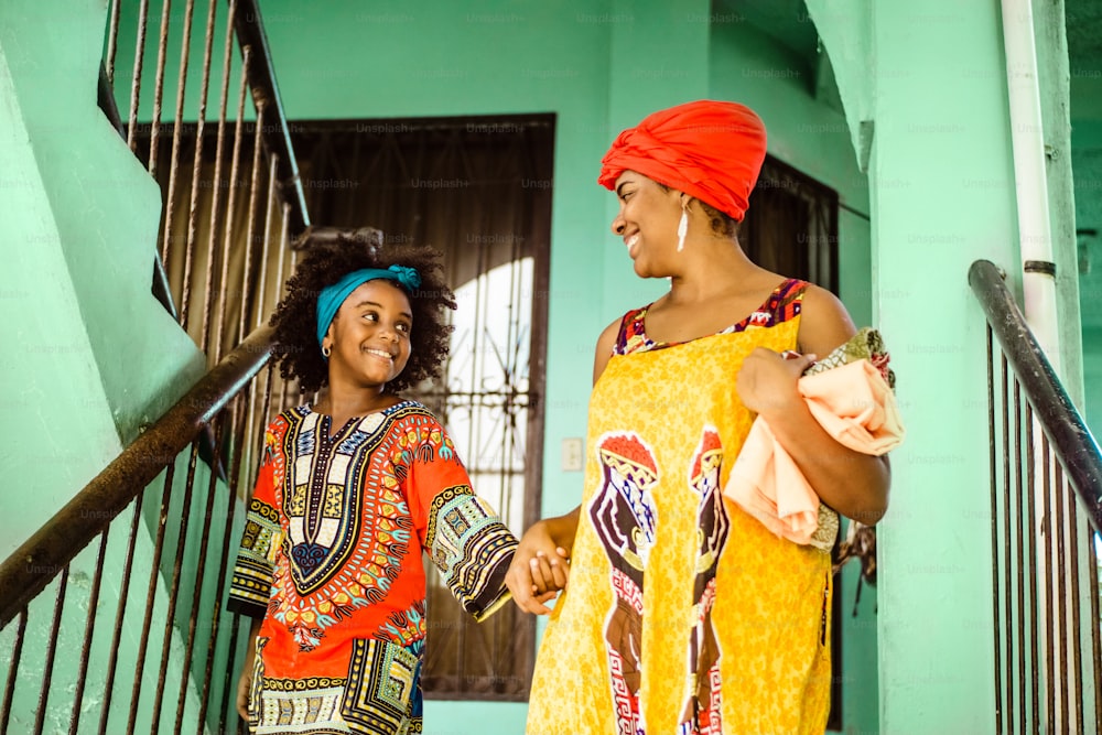 Portrait of black woman mother and daughter together, culture and traditional concept.