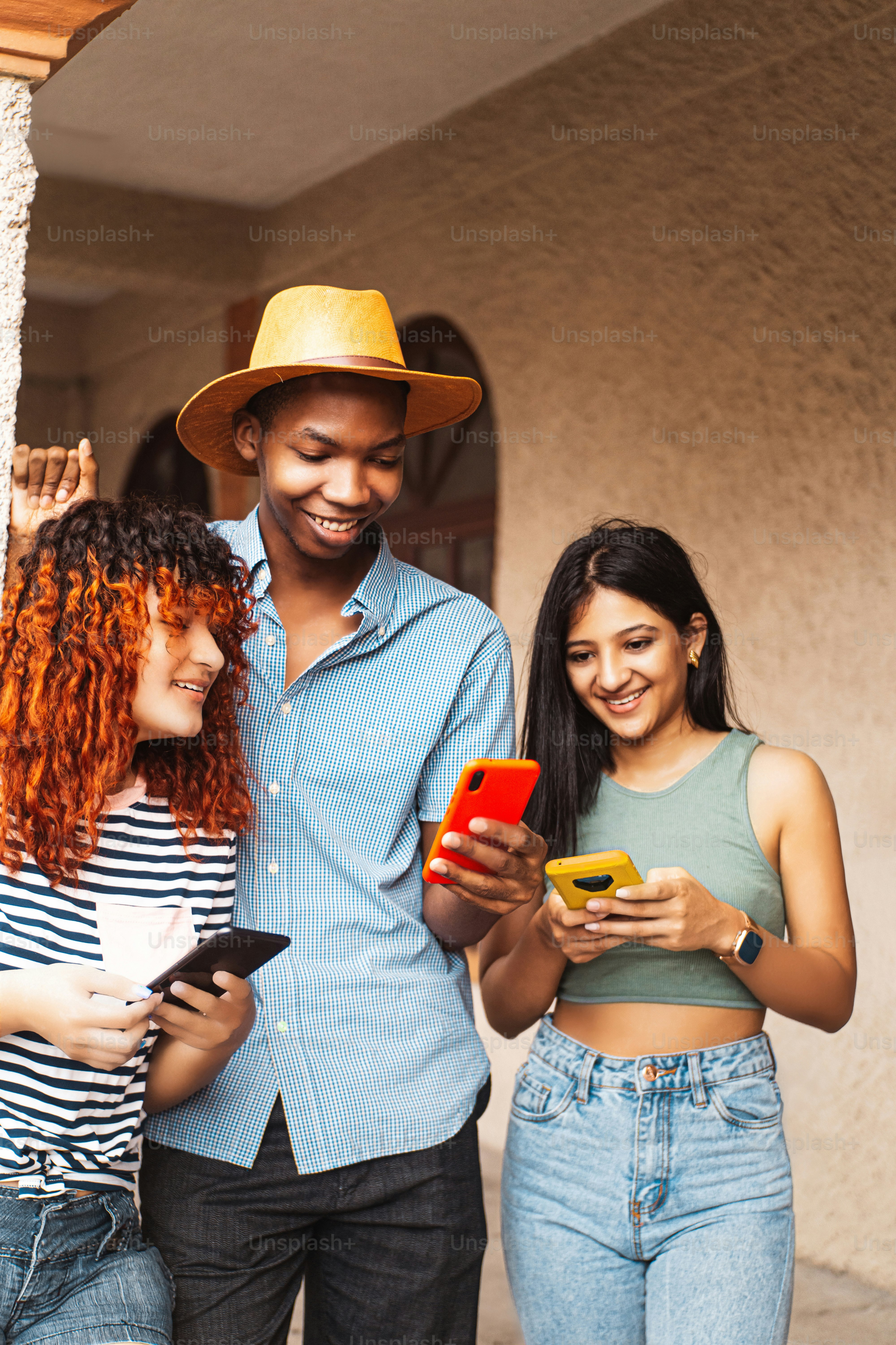 Group of friends using smart phones. photo – Digital world Image on ...
