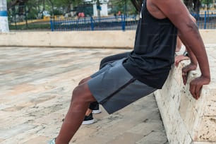 Two men exercising in city park