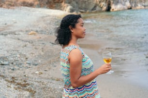 Beautiful Black woman holding a glass of wine