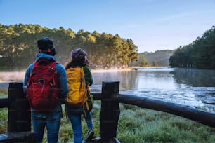 asia couple Pang Ung park travel take pictures of nature landscape the beautiful at lake, in Thailand.