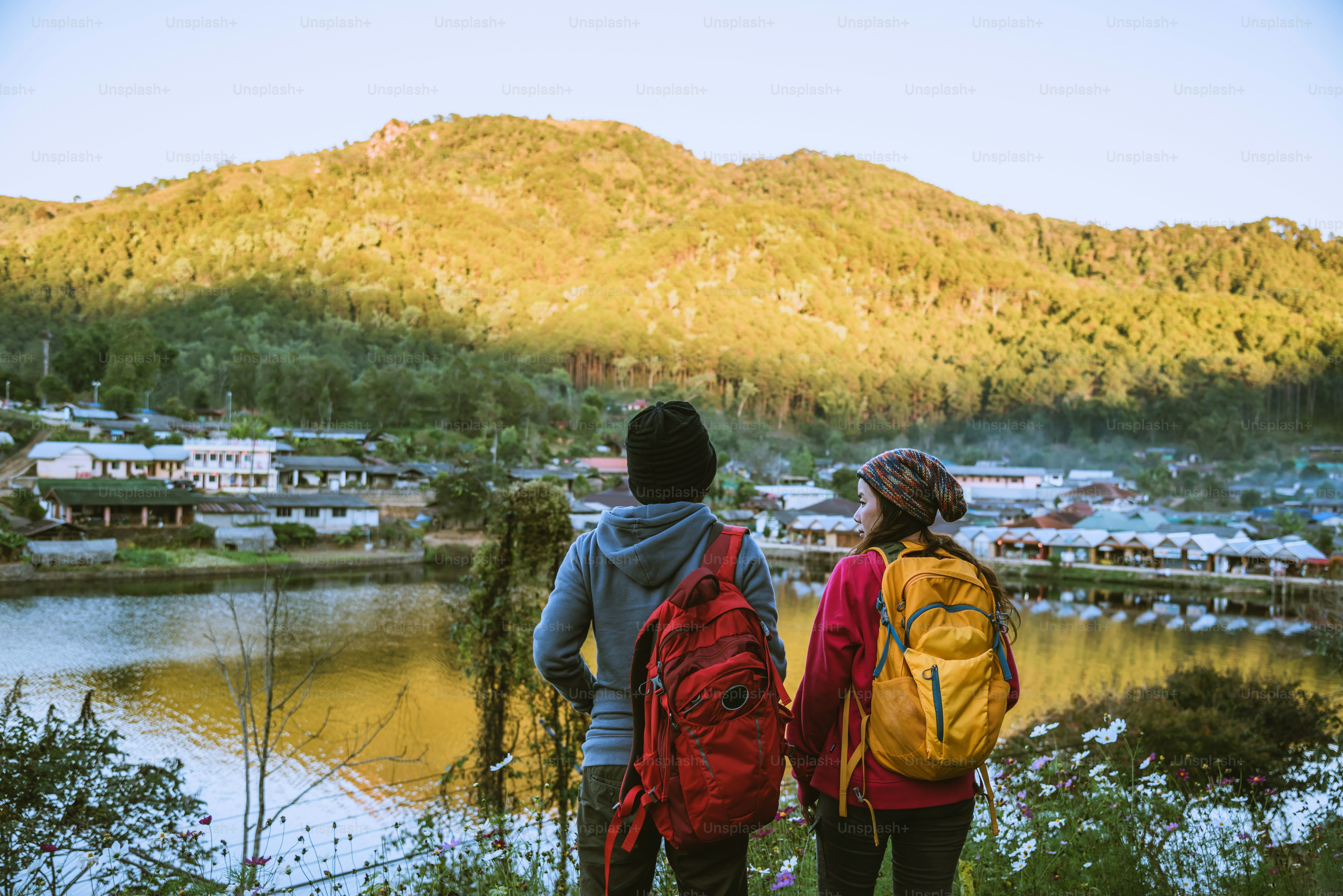 Lover women and men asians travel in the holiday.Travel relax, Natural Touch countryside, in Thailand.