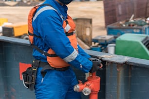 Marine deck officer or chief officer on ship's deck performing work