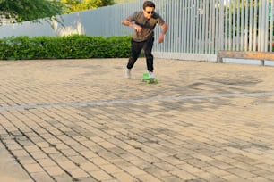 Young man skateboarding in an urban park as a hobby
