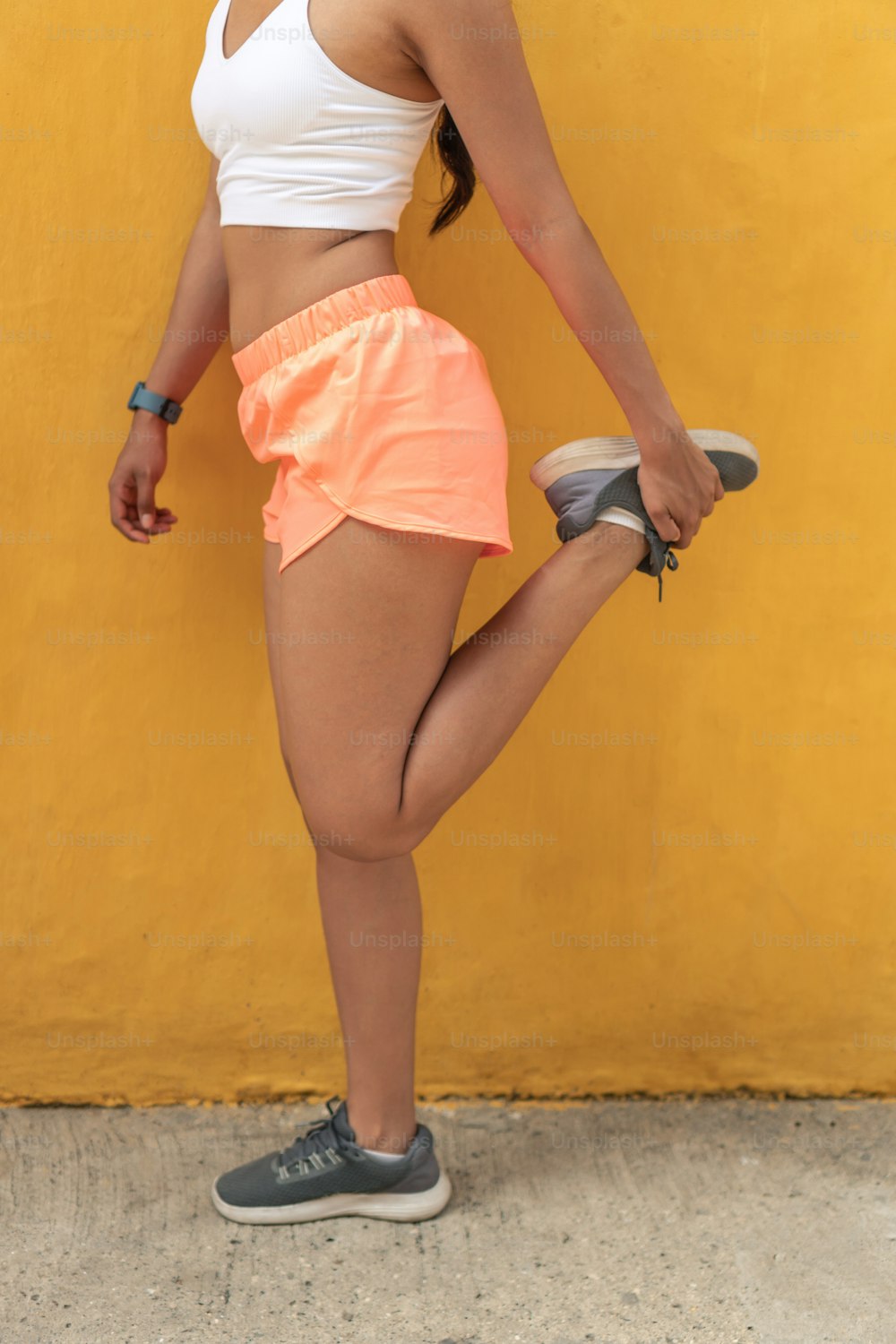 woman stretching before exercising on a sunny day.