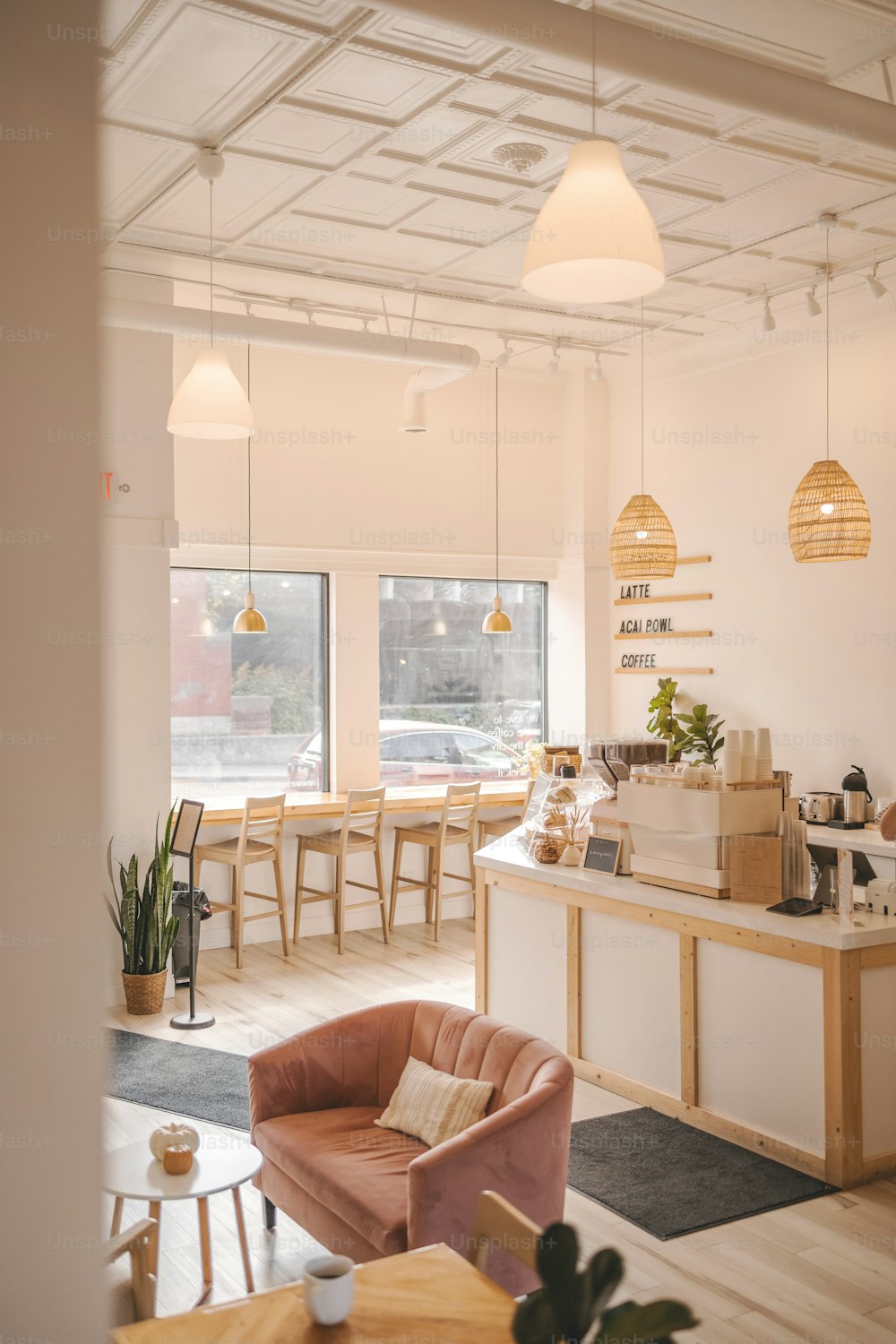 a room filled with furniture and lots of windows