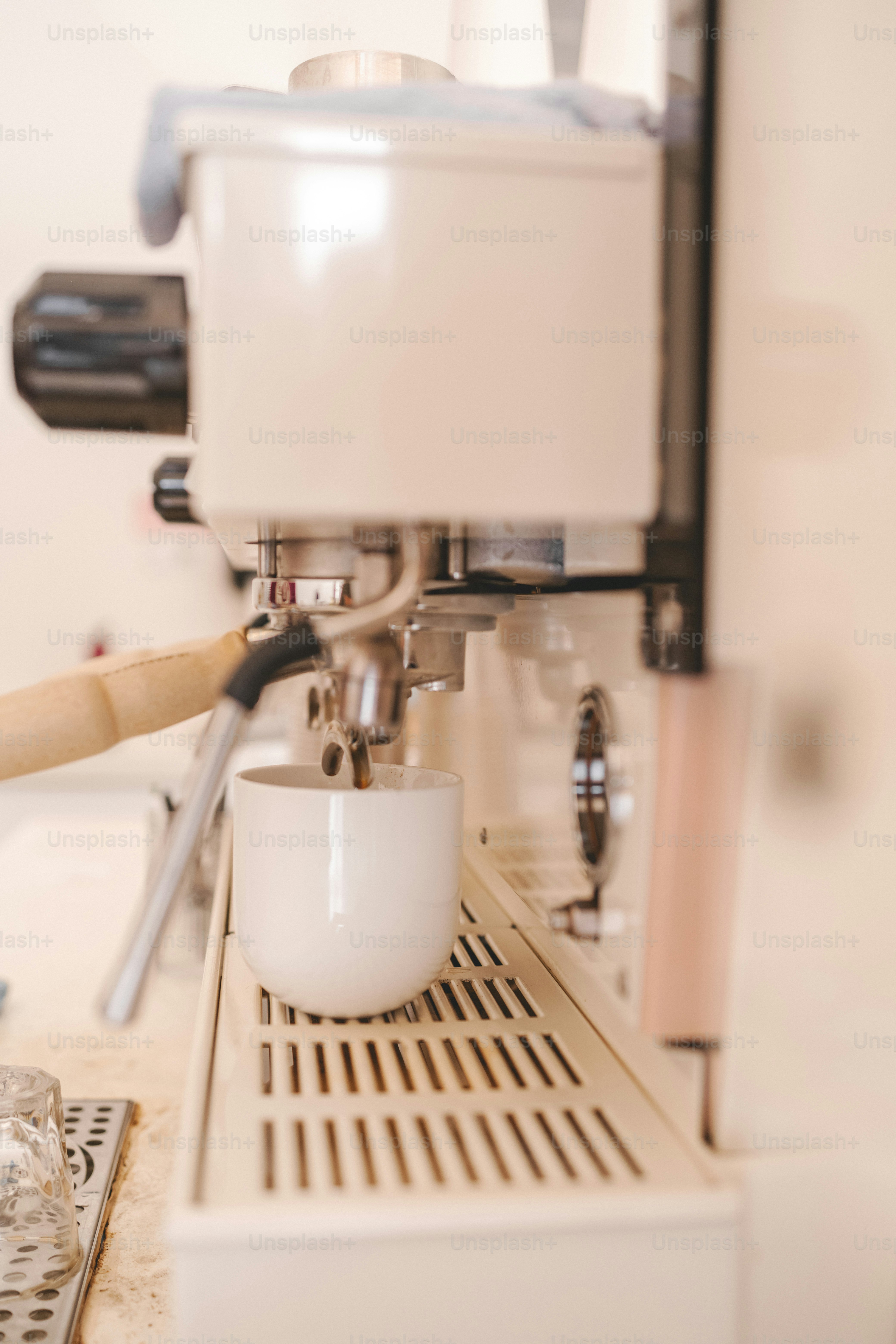 a coffee machine with a cup of coffee on it