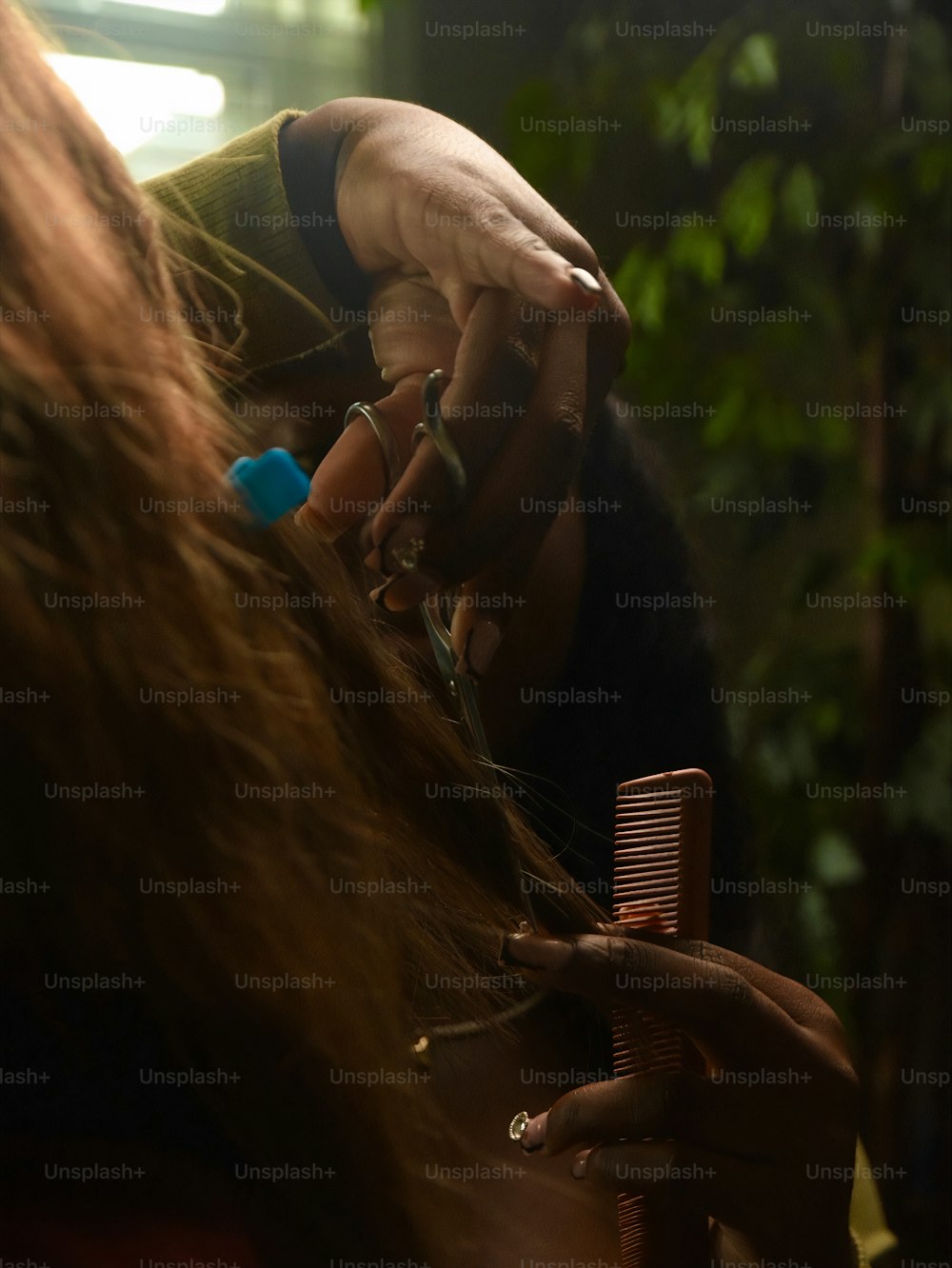a close up of a person getting their hair done