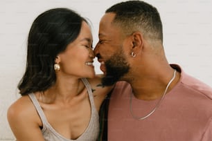 a man and a woman smiling at each other