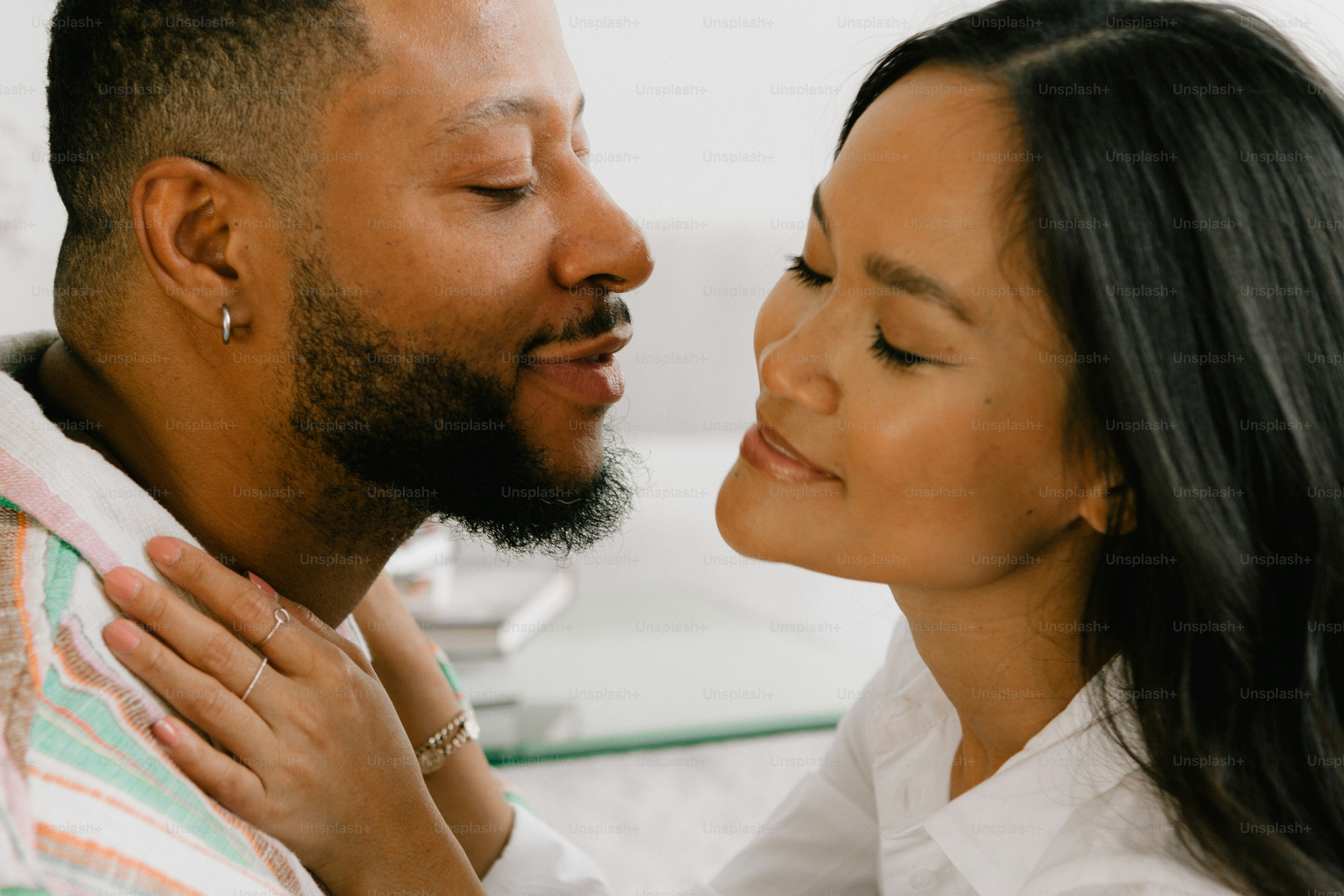 a man and a woman are smiling at each other