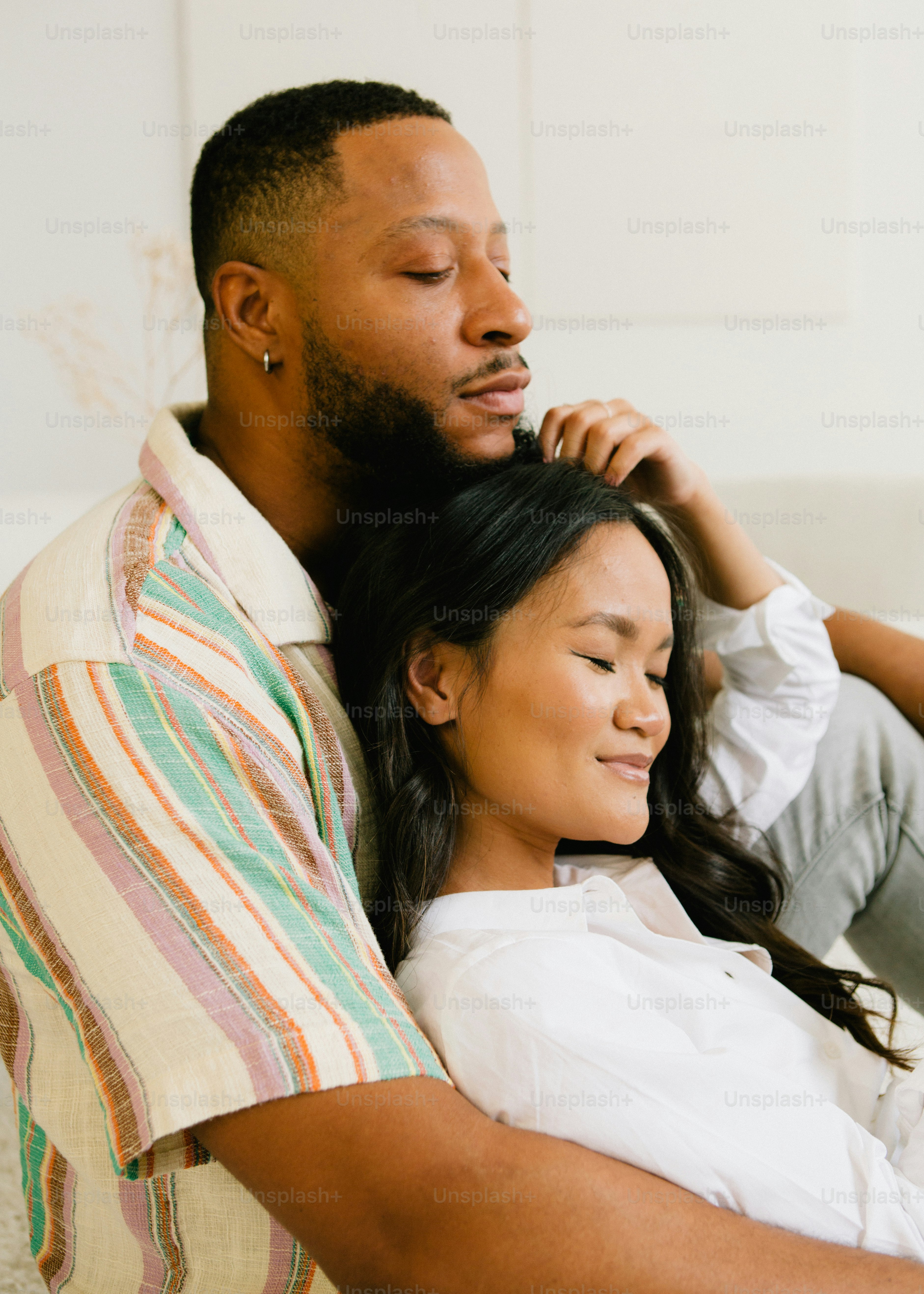 a man and a woman sitting on a couch