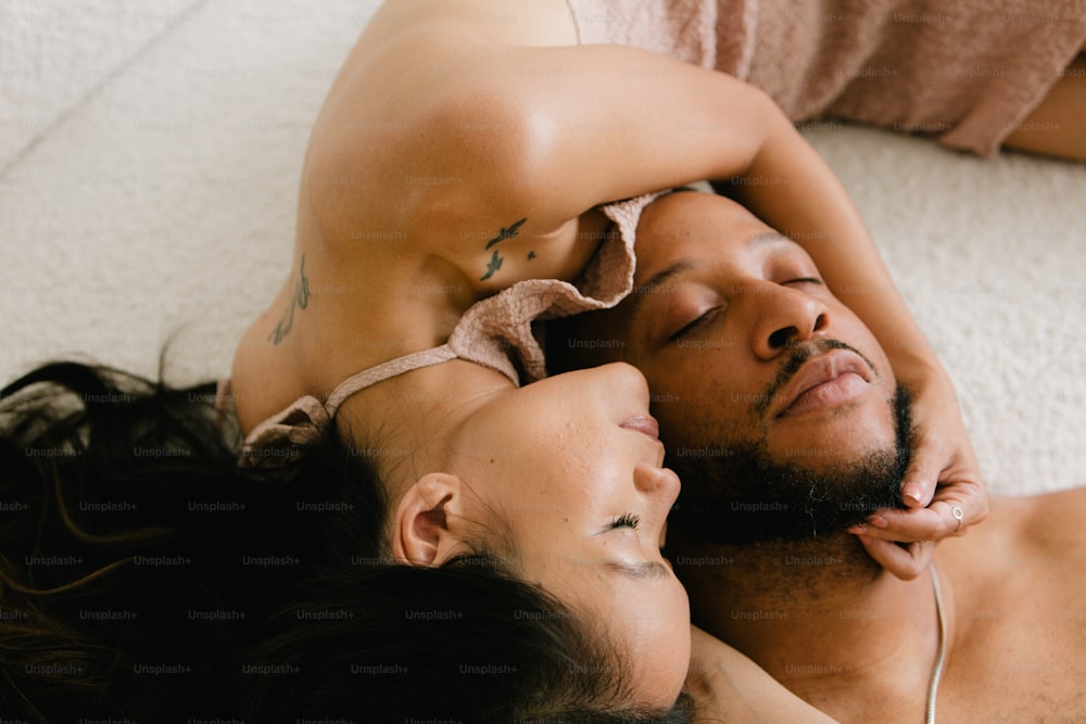 a man and a woman laying on the floor