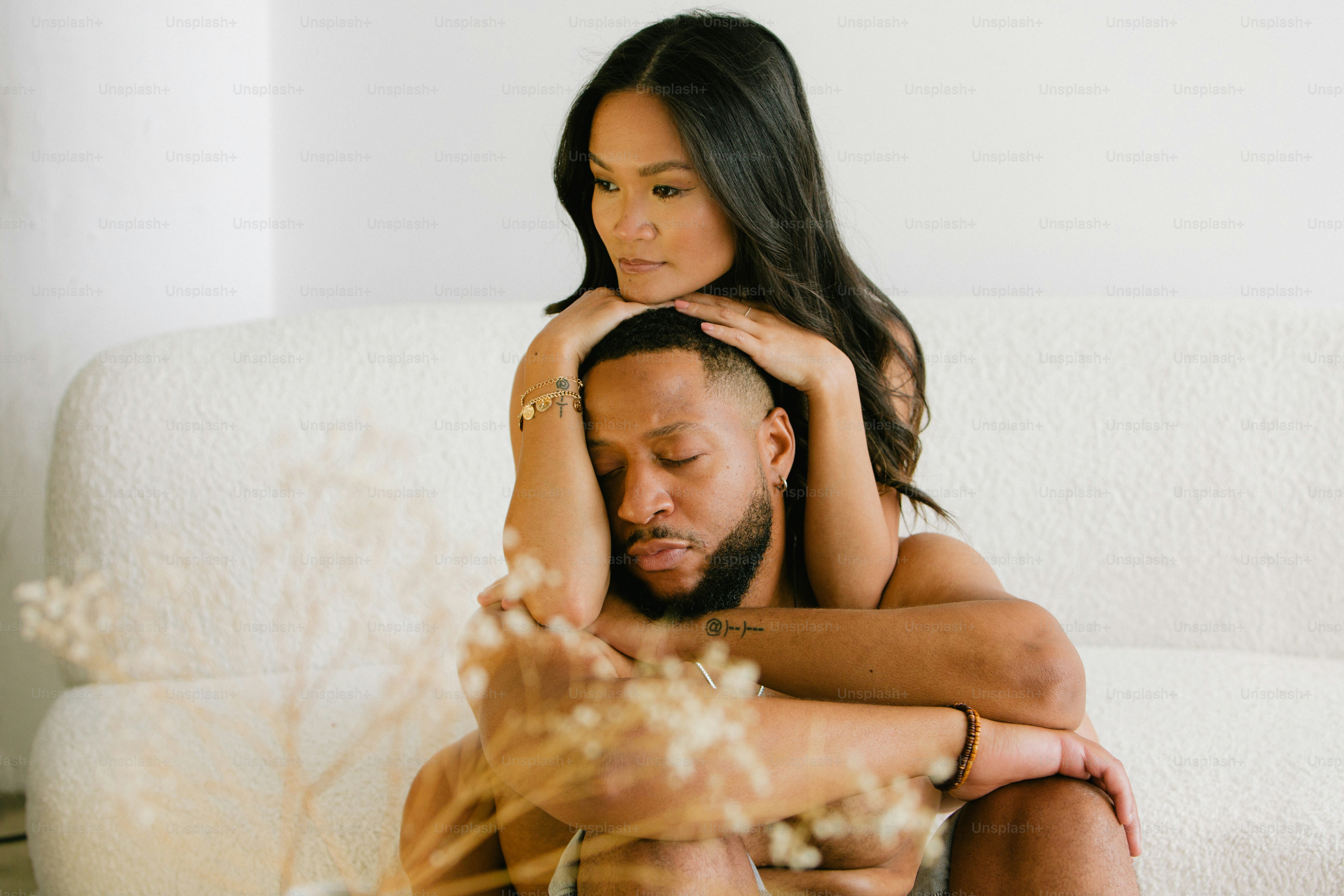 a man and a woman sitting on a couch