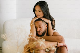 a man and a woman sitting on a couch