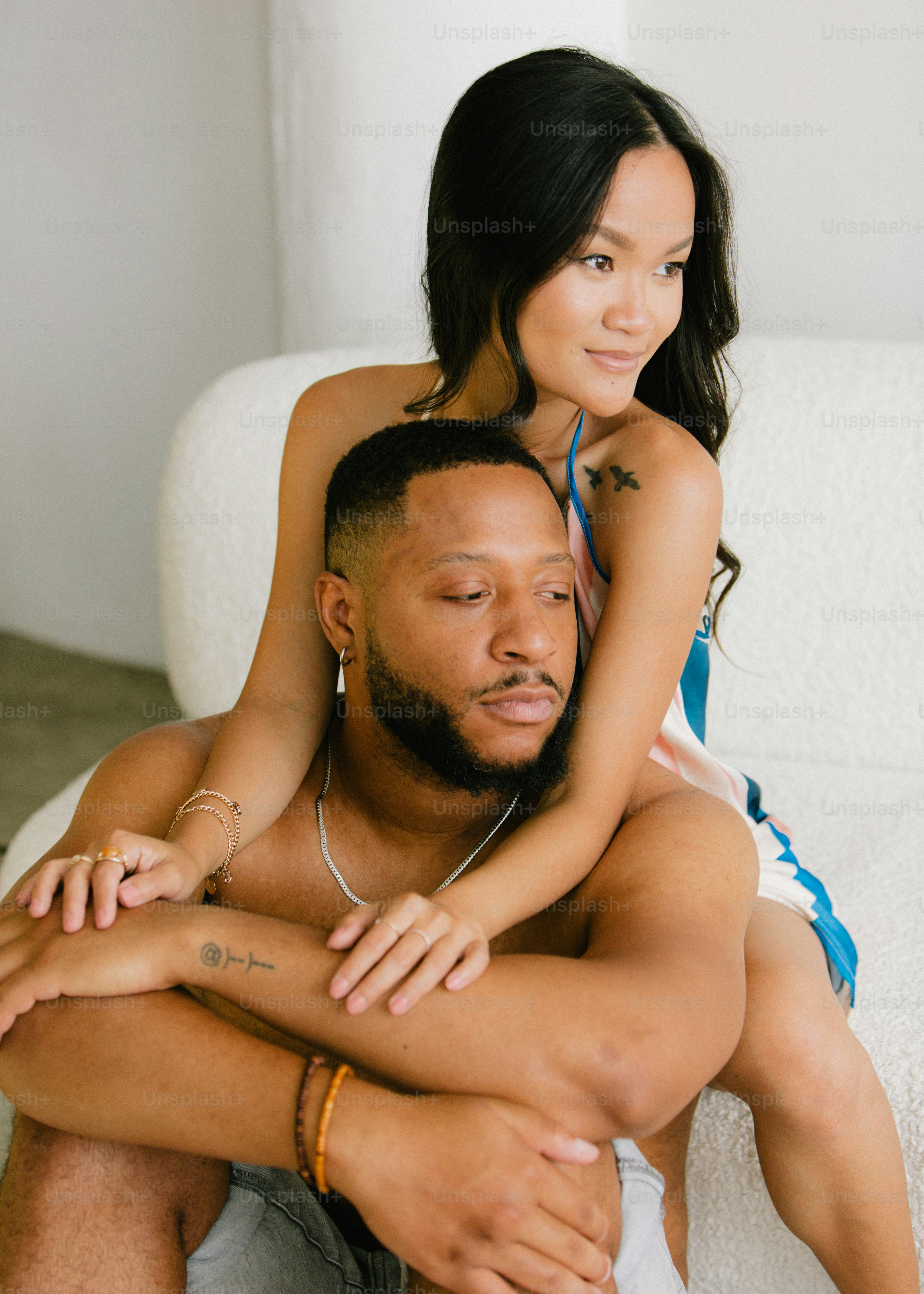 a man holding a woman on his back