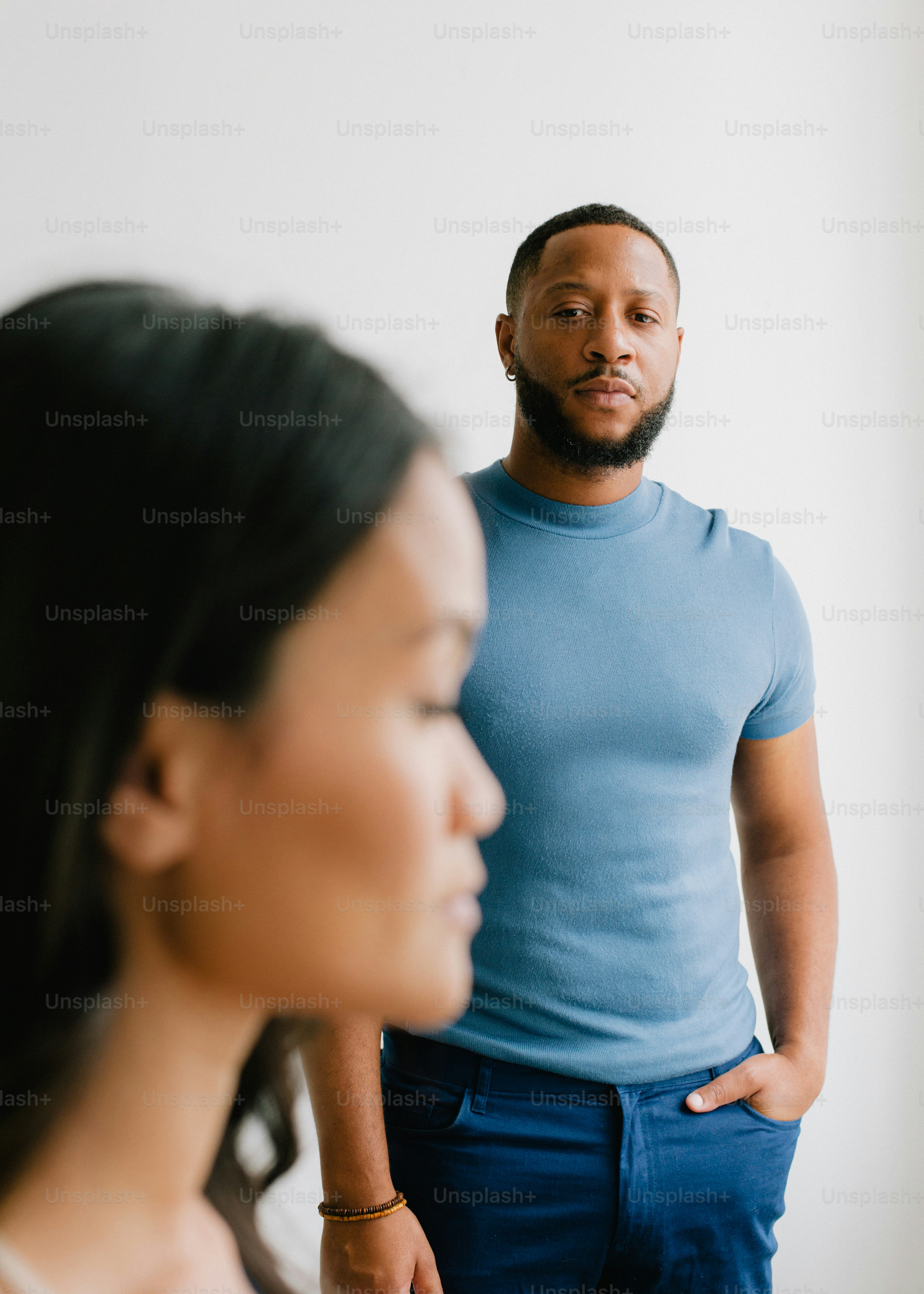 A man and a woman standing next to each other photo – Couple Image on ...