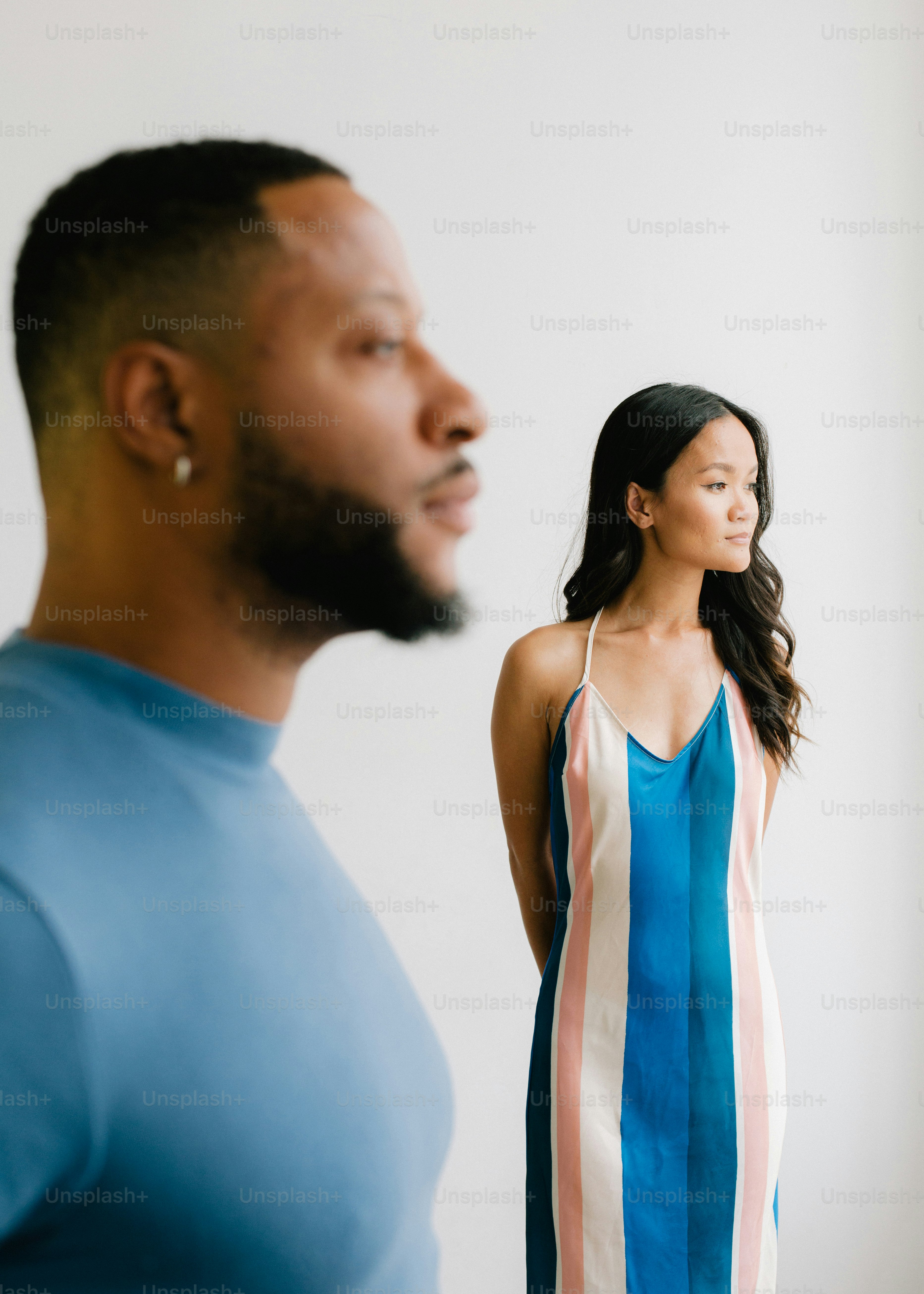 A man and a woman standing next to each other photo – Couple Image on ...