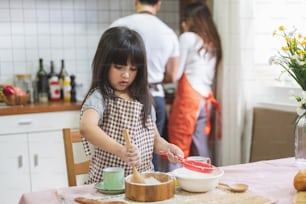 Happy Asian family cooking in kitchen, with happy and smile, lifestyle happy family concept