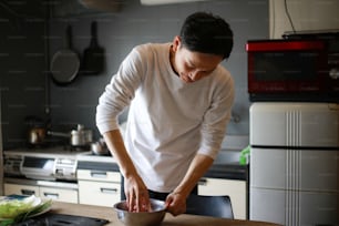 A man making gyoza dumplings