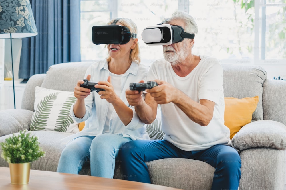 Couple senior enjoy playing VR 3D games at home
