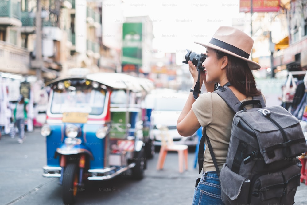 Asian traveler/tourist walking and travelling in Khao San rd. walk street, Bangkok, Thailand