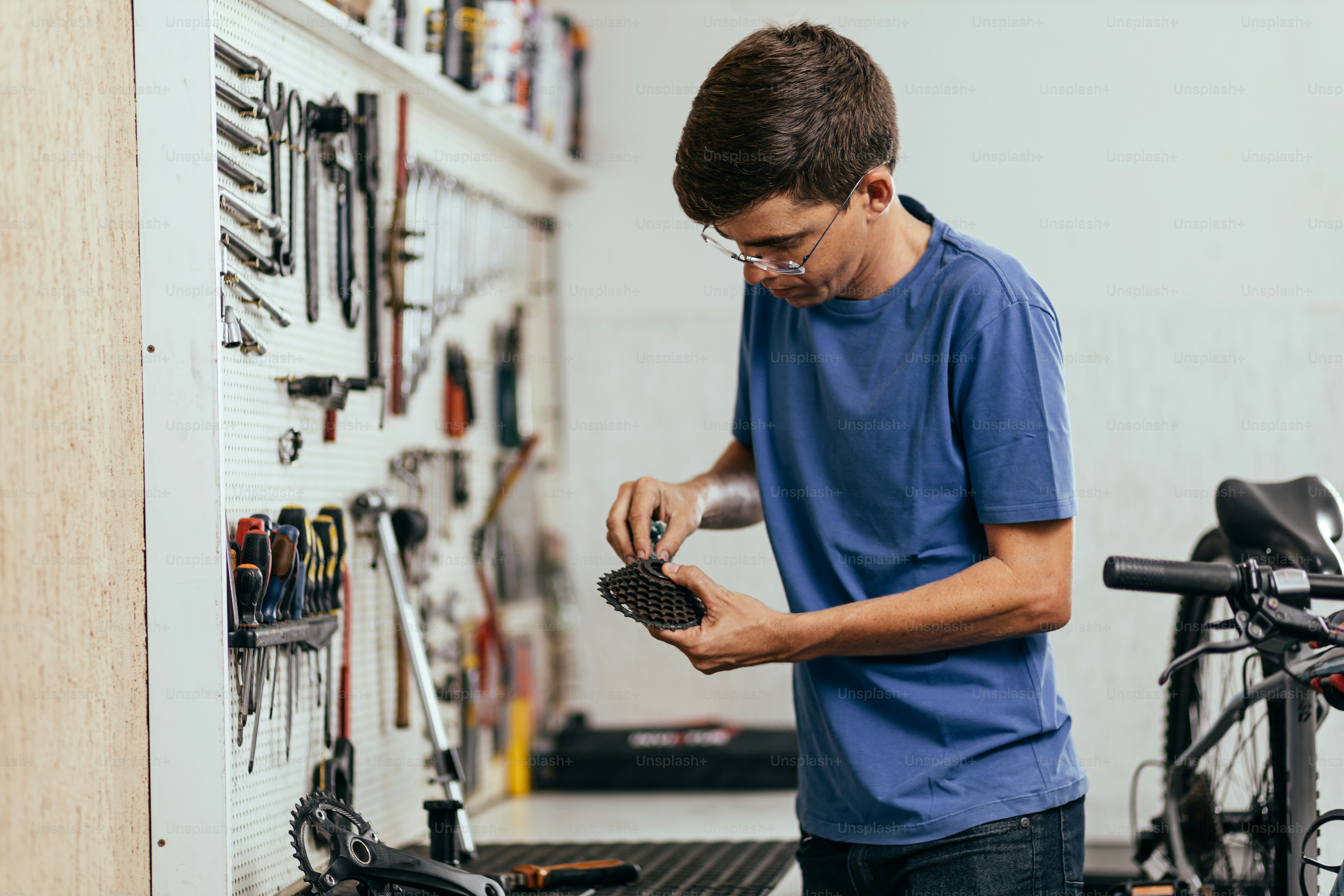 A man working in a bicycle repair shop