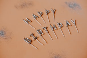 a happy birthday message made out of candles