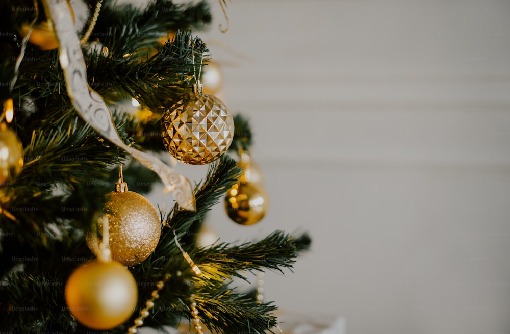 a close up of a christmas tree with ornaments