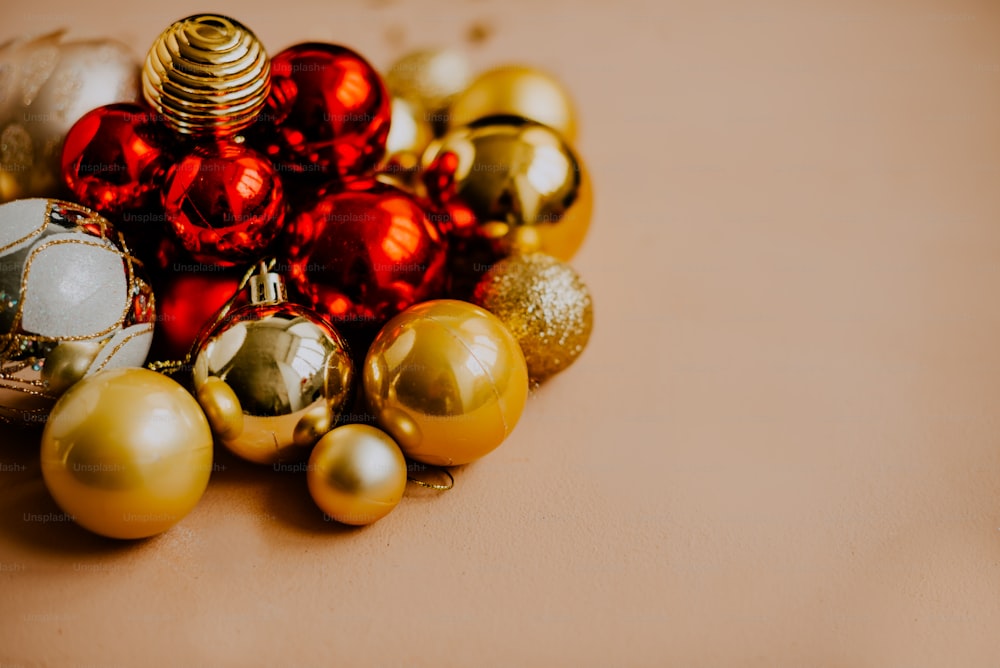 a pile of christmas ornaments sitting on top of a table
