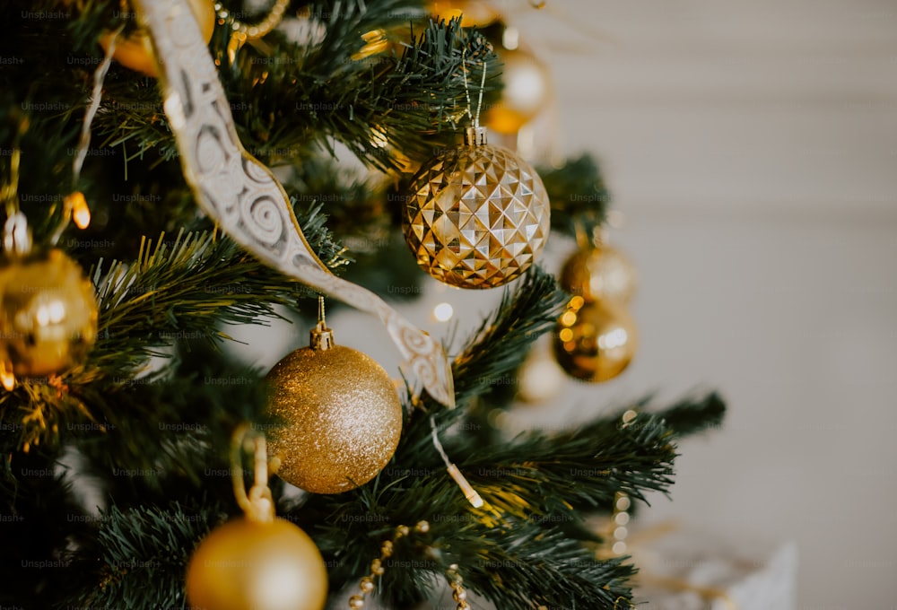 a close up of a christmas tree with ornaments