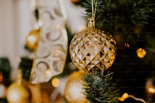 a close up of a christmas ornament on a tree