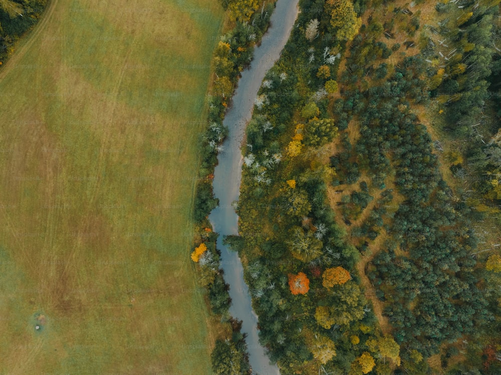 an aerial view of a golf course with a river running through it