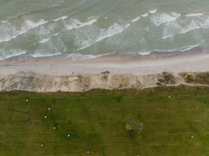 an aerial view of a beach and ocean