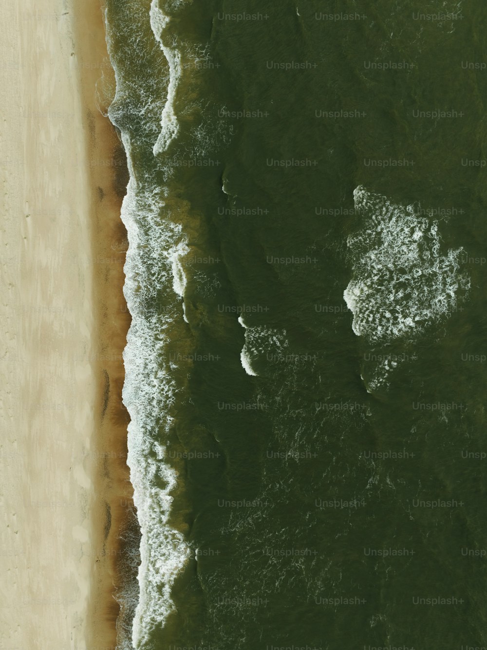 a bird's eye view of a beach and ocean