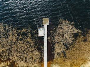 an aerial view of a dock in a body of water