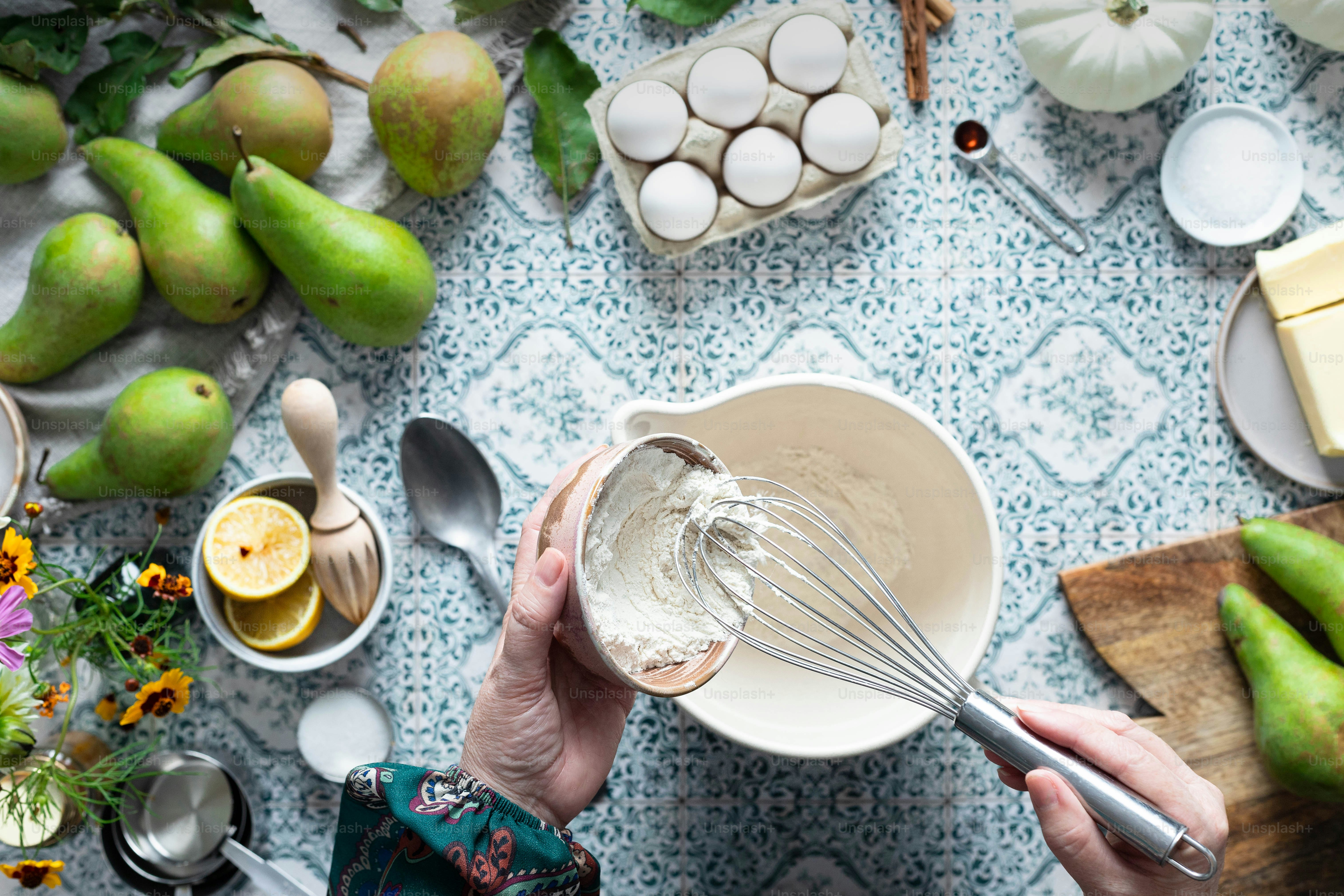A person whisking something in a bowl with a whisk photo Mixing Image on Unsplash