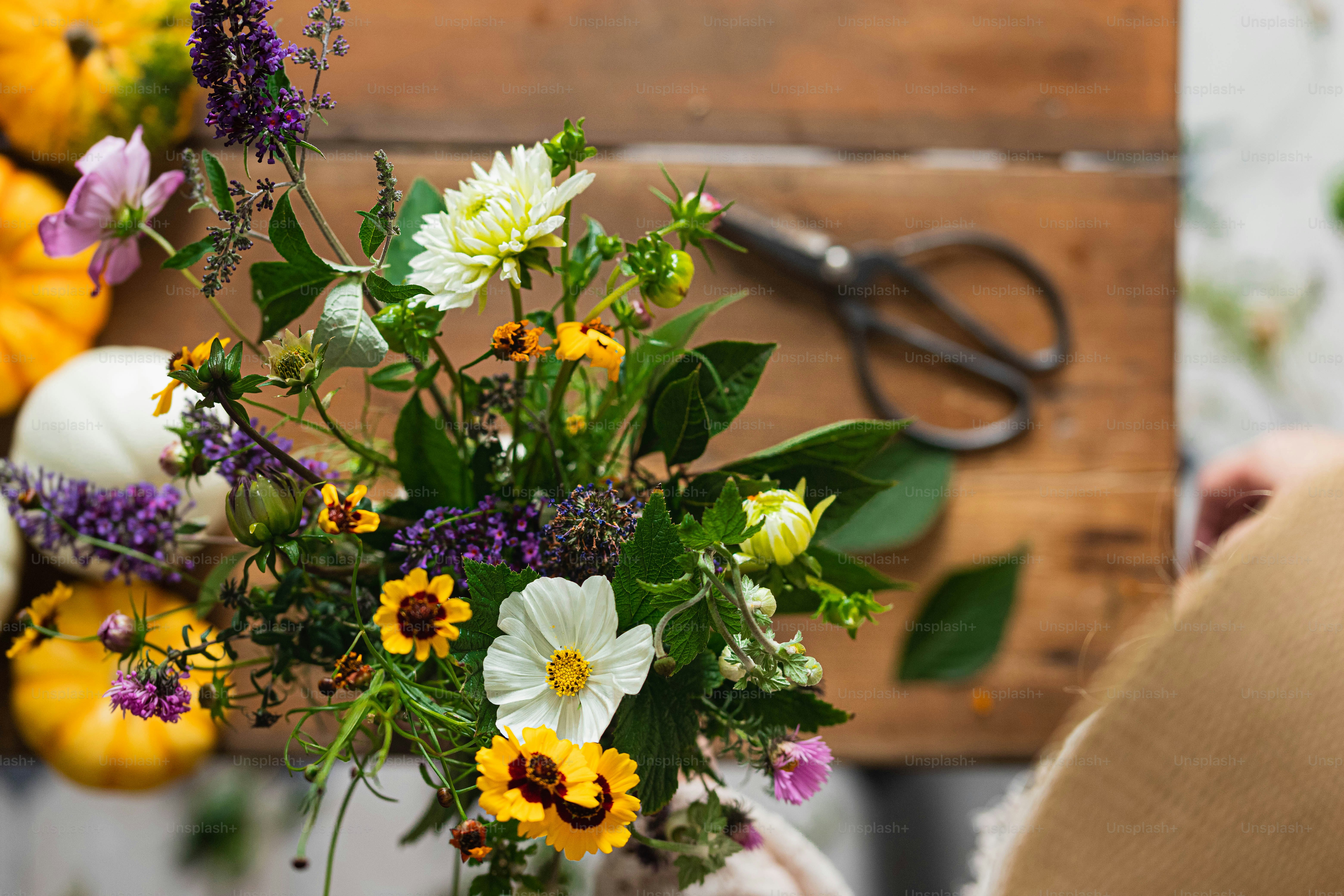a bunch of flowers that are in a vase