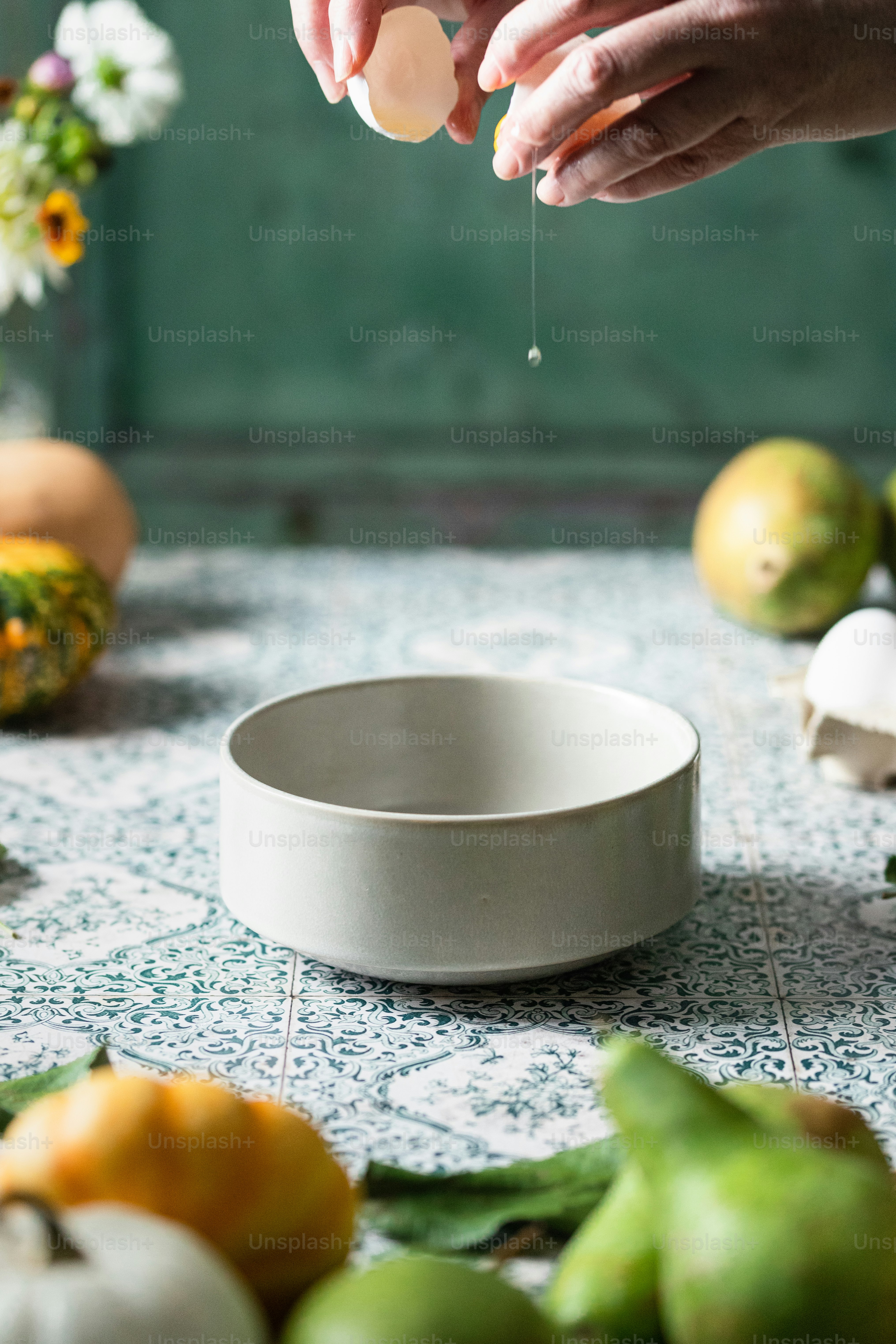 a person is dipping something into a bowl