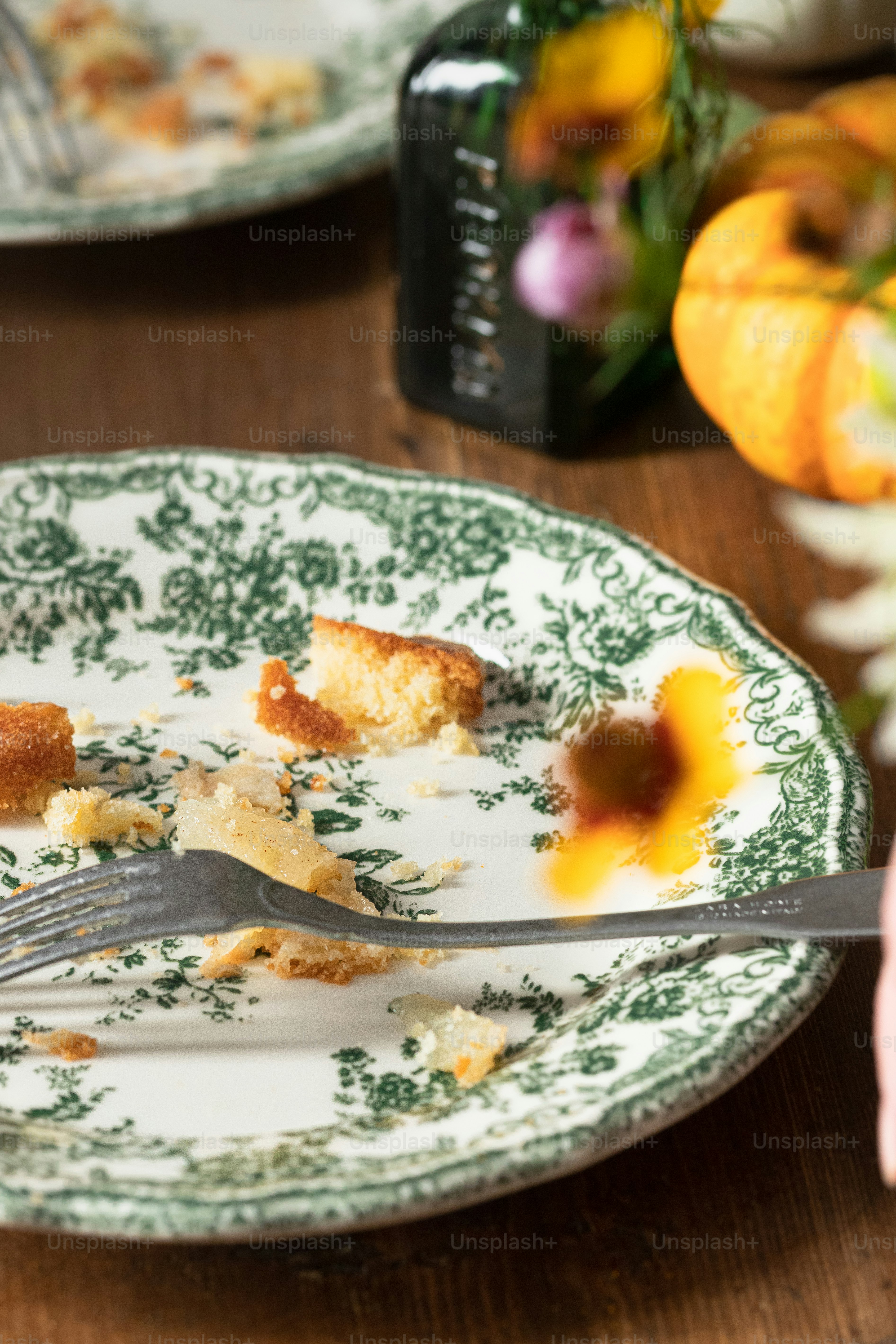 a plate with a half eaten piece of cake on it
