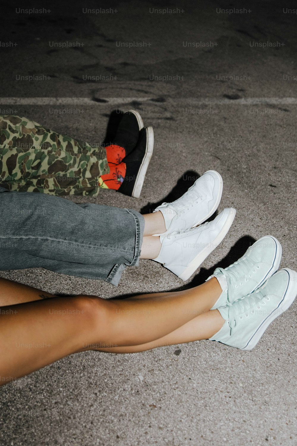 A person laying on a bed with their feet up photo – Free Sneaker Image on  Unsplash