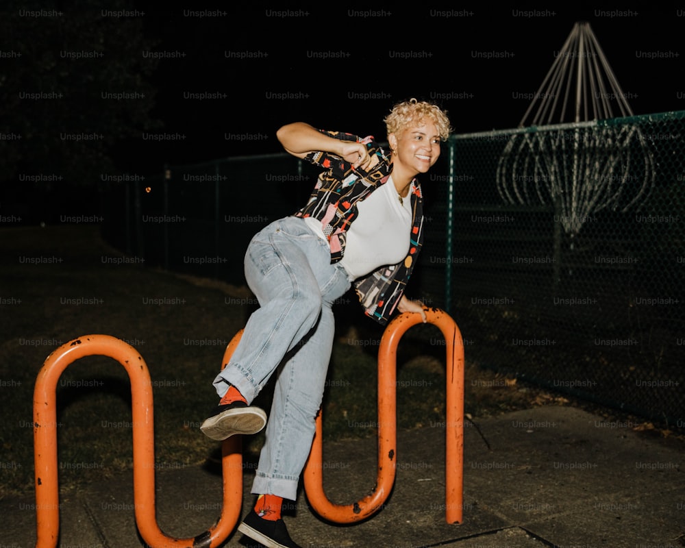 a man riding a rail on top of a skateboard