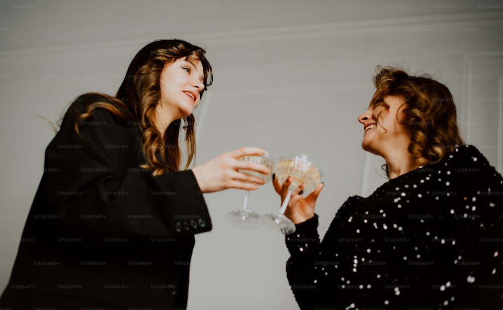 a couple of women standing next to each other